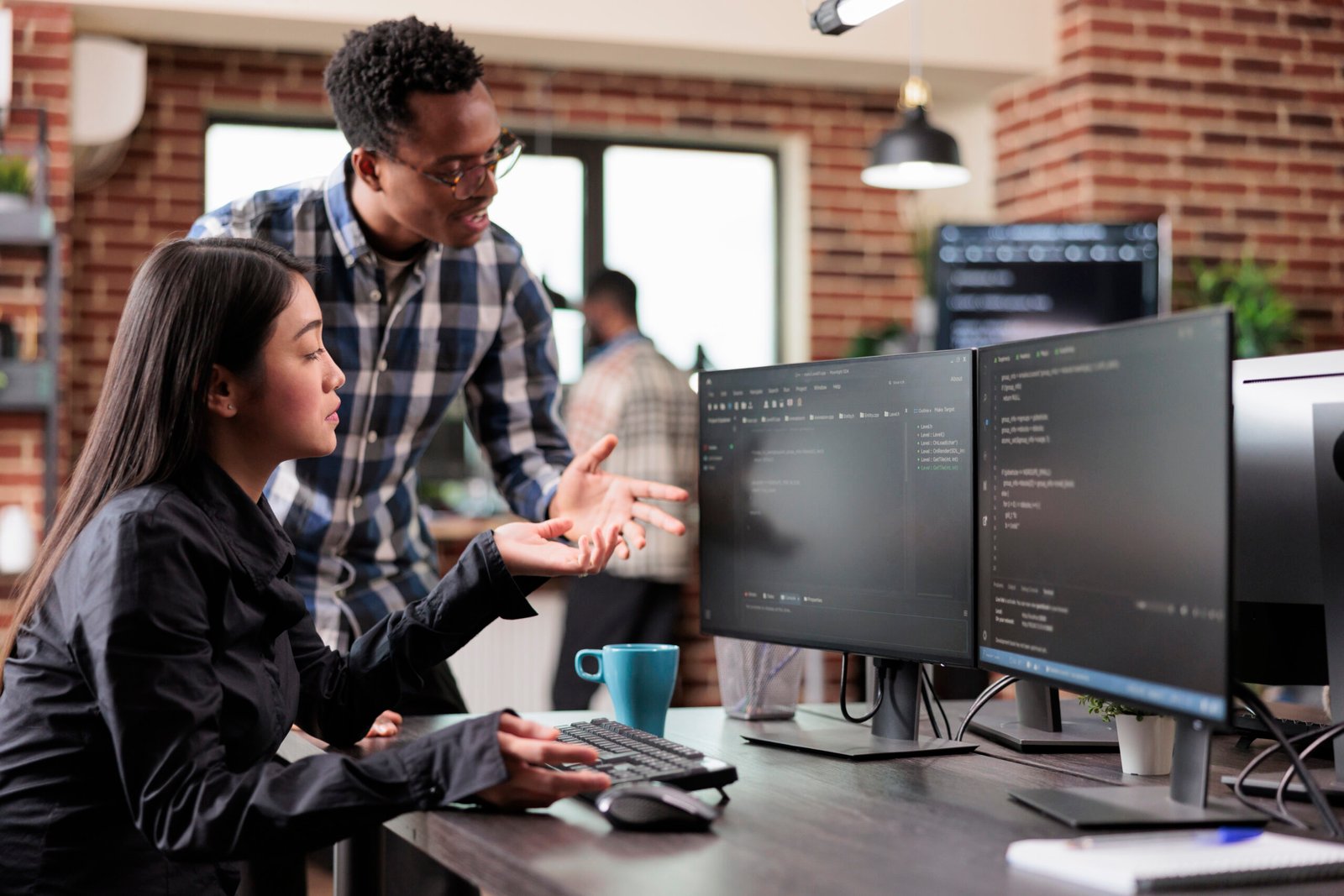 Multiethnic cyber security team developing software algorithm for information processing and network optimization. Informational agency multiracial tech enginners programming application while using computer.