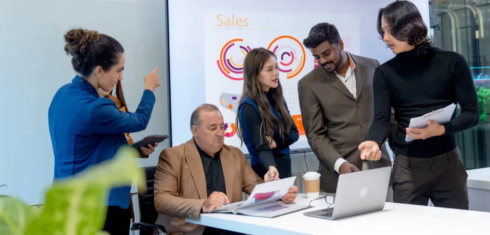 The Impact of Strategic Software Consulting on Start-ups and Enterprises Group of business men and women with multiethnic and multigeneration discuss in the conference room to get the success of the project.