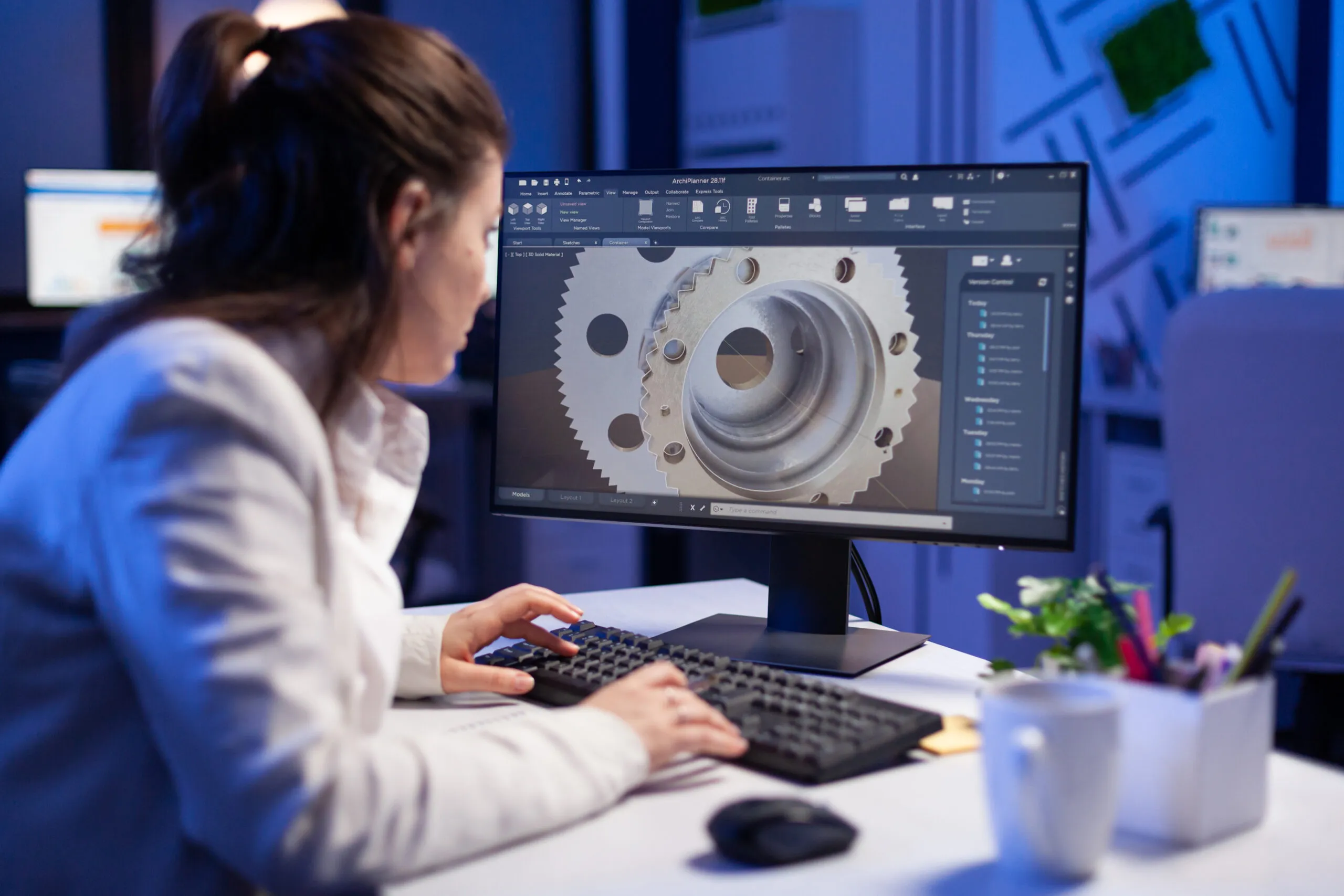Woman engineer working on new digital prototype using professional construction equipment late at night at office company. Entrepreneur looking at technical architecture before deadline