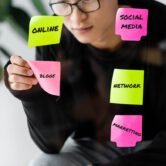 asian seo manager sticking paper with blog illustration on glass