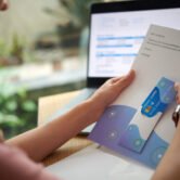 Hands of woman taking credit card out of letter from bank