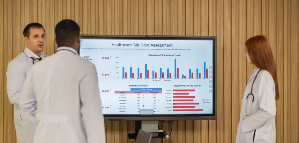 Doctor team analyzes big data, creates cost-effective plans for Team of doctors discuss healthcare big data to analyze patient satisfaction trends, waiting status, turnover rates aiming to identify areas for improvement, create cost effective management plans.