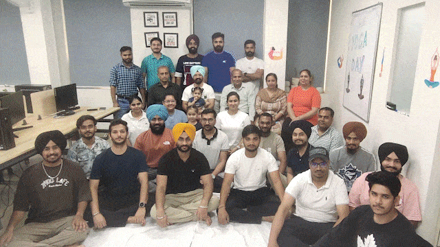 Zimo Technologies team members in office workspace