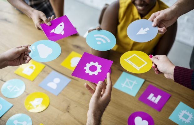 Group of computer icon on the wooden table
