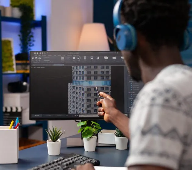 African american architect person analyzing skyscraper construction plan looking at building concept working remote from home. Young engineer developing business corporate workplace sketch