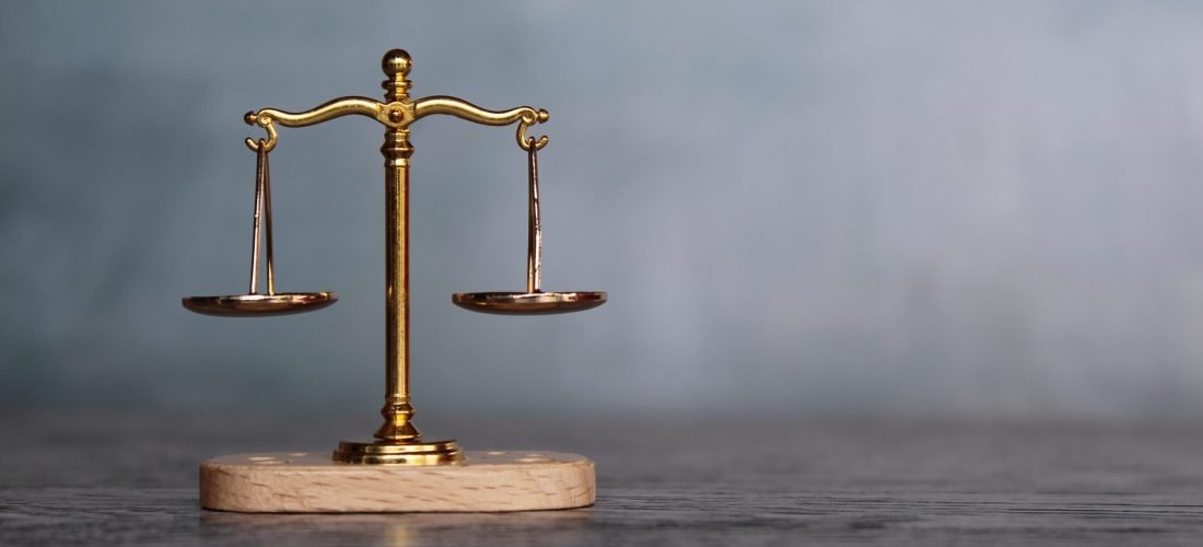 Balancing scale on top of wooden table with copy space for text