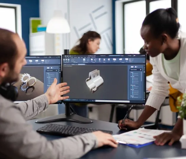 Diverse team of engineer architects working on modern cad program developing construction metalic components. Industrial designer studying prototype idea on pc showing digital software with gears