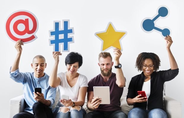 People holding an social media icon People holding an social media icon